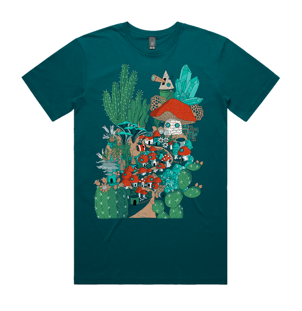 An Aquamarine color T-shirt with a picture of A colorful town nestled between the desert landscape consisting of little houses made out of mushrooms cactus and various windblown garbage. 